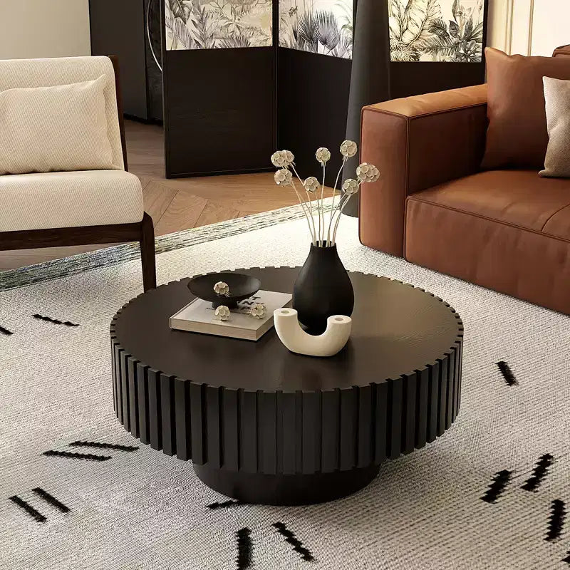 Table basse ronde avec relief en forme d'olive sculpté à la main
